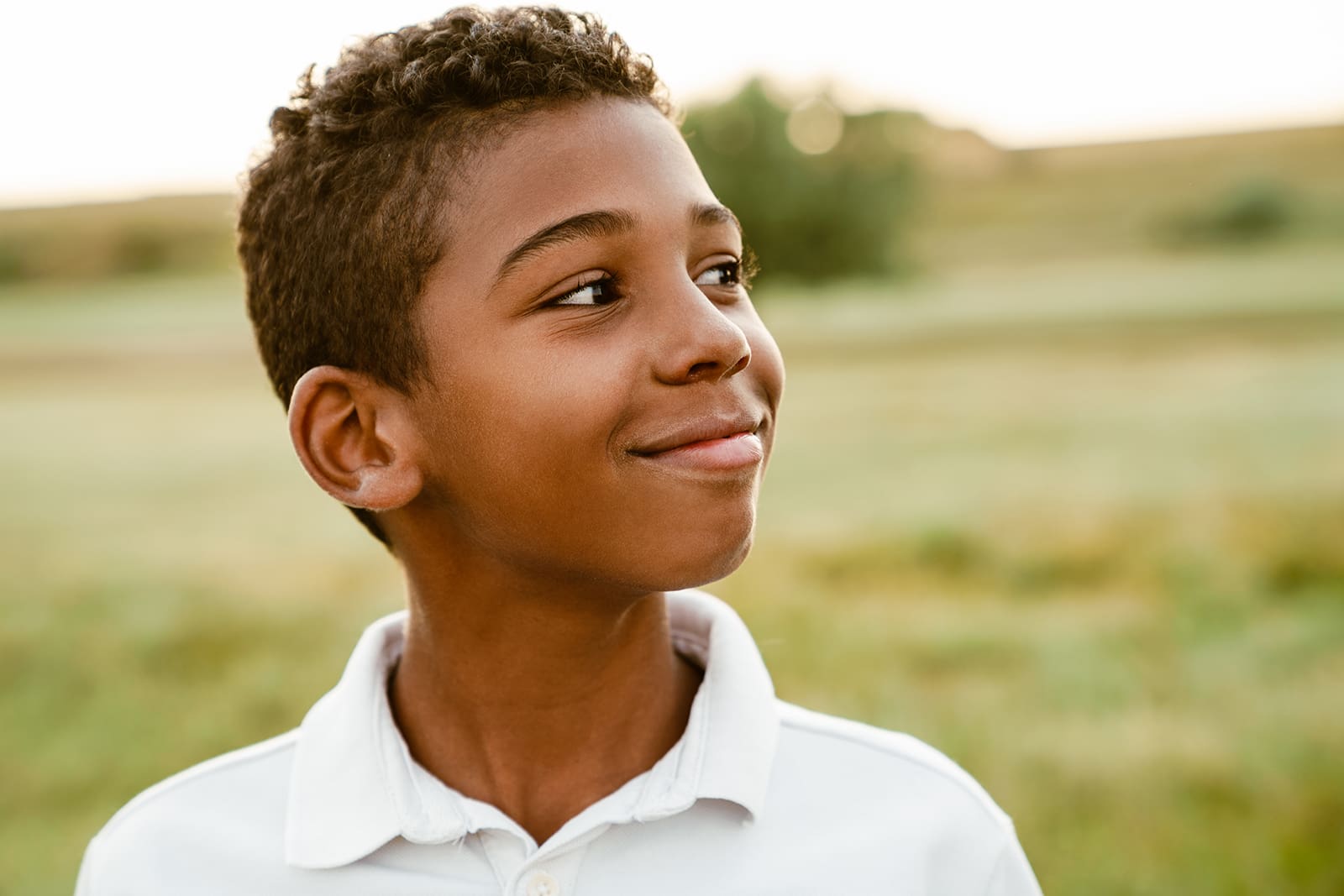 Black boy wearing white shirt smiling and looking aside, MIND.IT program, Wayne, PA